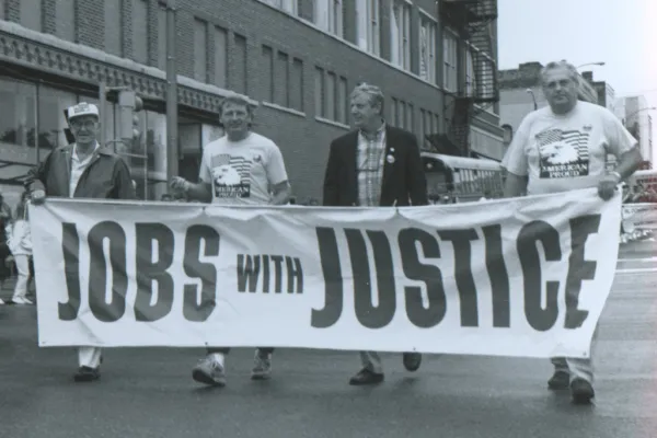 In 1977, the Bloomington Labor Day Parade was revised. In this early 1980s photo, Nick Petri Sr. (retired railroader), John Penn, Laborers 362, Charles Stott, National AFL-CIO staff and Trades & Labor Assembly President and Laborers 362 member Ronn Morehead help lead the parade.  Mike Matejka photo