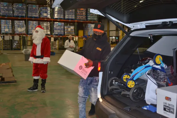 Local union volunteers load up toys & candy for low income families 