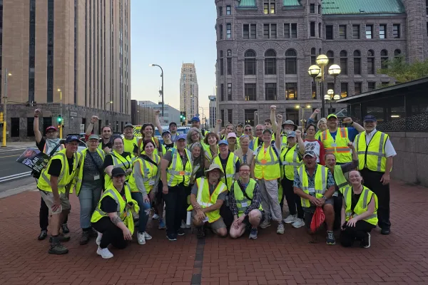 Photo of a group of union peacekeepers wearing yellow safety vests in downtown Minneapolis.