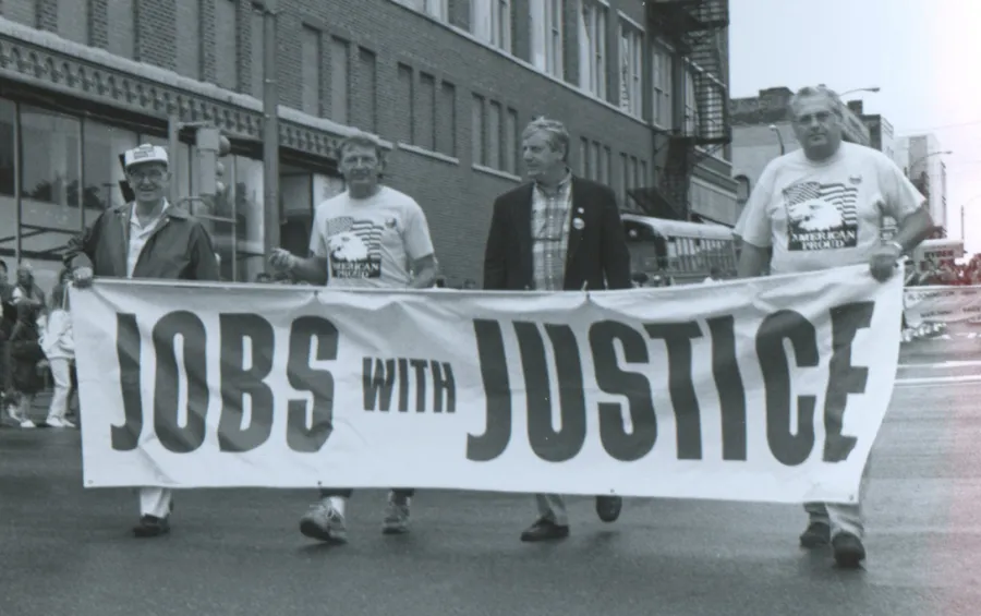 In 1977, the Bloomington Labor Day Parade was revised. In this early 1980s photo, Nick Petri Sr. (retired railroader), John Penn, Laborers 362, Charles Stott, National AFL-CIO staff and Trades & Labor Assembly President and Laborers 362 member Ronn Morehead help lead the parade.  Mike Matejka photo