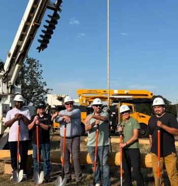 Community members pose with their ground-breaking shovels