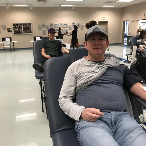 Father & Son - Tony Penn (foreground) and Nathan Penn (both LIUNA 362) donate at the union blood drive, January 21, 2023.