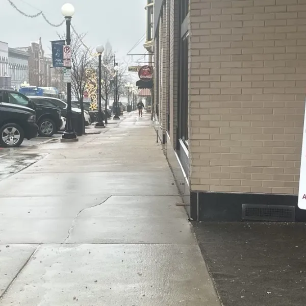 UA Local 99 members Ben Duez and James Whiteside protest Catalyst using out of town Paluska plumbing to renovate the Red Racoon game store in downtown Bloomington