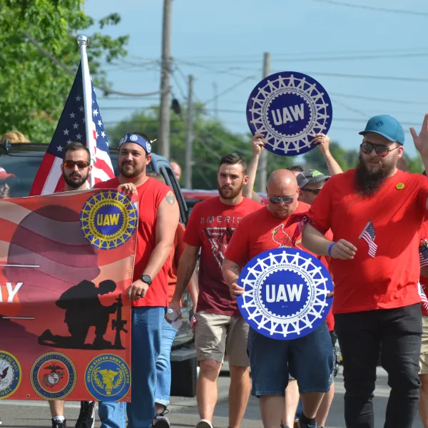 The United Auto Workers participated in the 2023 Bloomington Memorial Day Parade.  The UAW is one union seeking to organize Rivian Automotive workers.