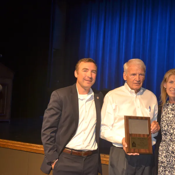 Laborers 362 retiree John Penn was honored as a McLean County Museum of History "History Maker" on June 18, 2024, at Illinois State University.  Shown with him are grandson Tim Ryan and daughter Shawn Eiker.