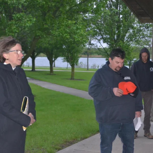 Rev Mollie Ward leads invocation, Workers' Memorial Day, White Oak Park, Bloomington IL April 28, 2026